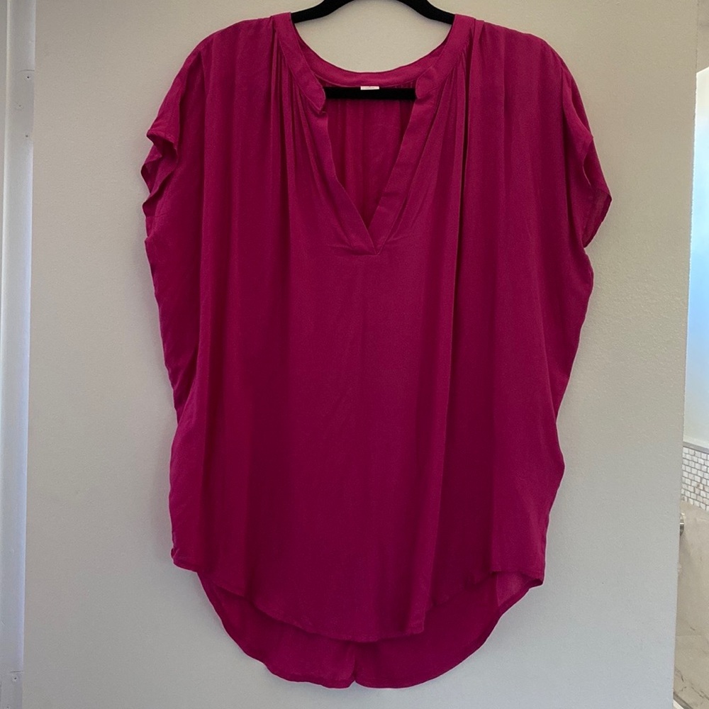 Blouse size S in rich fuchsia color.